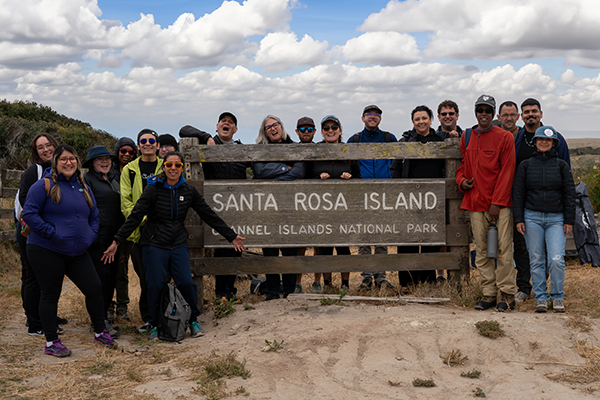 people in front of Santa Rosa Island sign